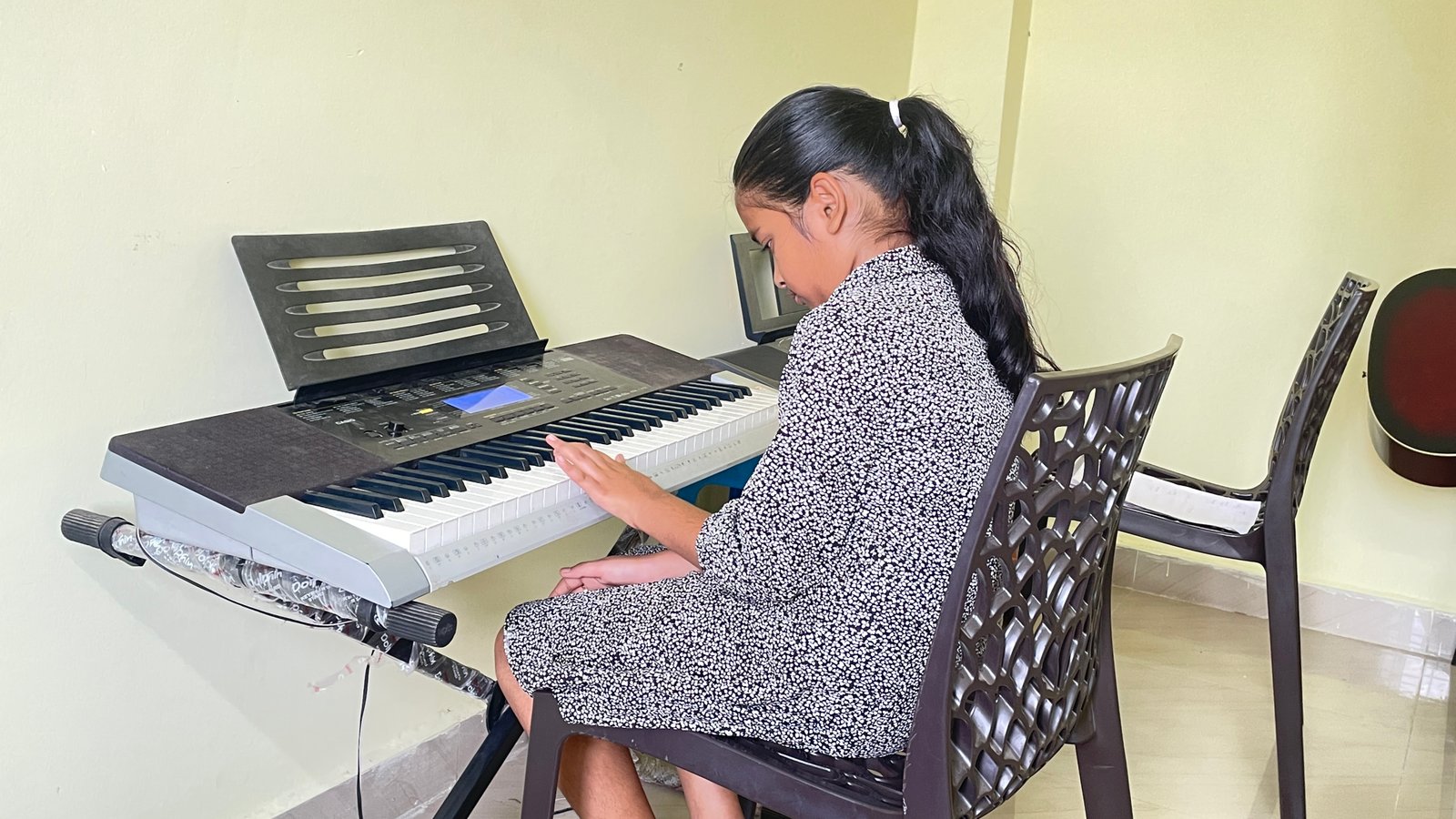 Student practicing keyboard at Three Stars International Music Academy